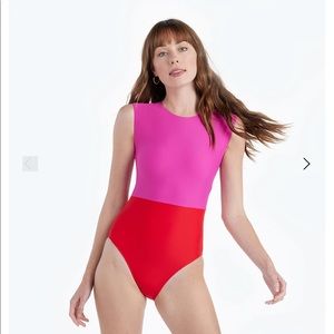 Summersalt The Surf swimsuit in lava and hibiscus.
